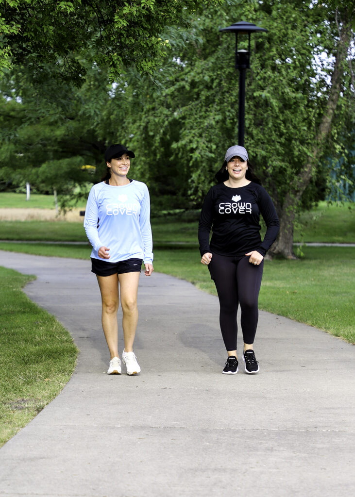 two women walking with UPF clothing on